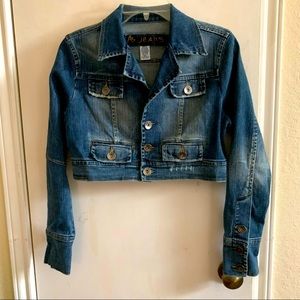 NWOT short jacket jeans, multiple pickets in the front long sleeves size S